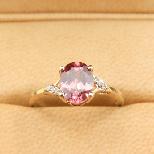 293 - Pink Garnet Solitaire Ring Further Set with Diamonds to Shoulders Mounted on 9 Carat Yellow Gold Ban... 