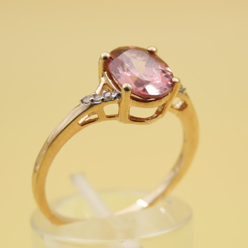 293 - Pink Garnet Solitaire Ring Further Set with Diamonds to Shoulders Mounted on 9 Carat Yellow Gold Ban... 