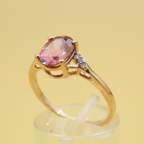 293 - Pink Garnet Solitaire Ring Further Set with Diamonds to Shoulders Mounted on 9 Carat Yellow Gold Ban... 