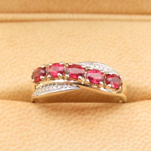 303 - Red Garnet and Diamond Set Cross Over Design Ring Mounted on 10 Carat Yellow Gold Band Size P and a ... 