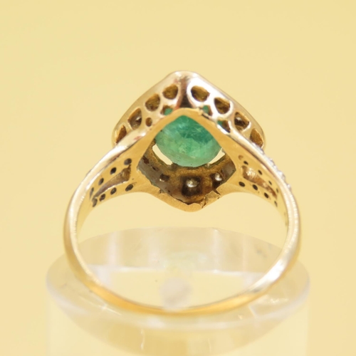 307 - Emerald and Diamond Ladies Cluster Ring Mounted on 18 Carat Gold Band