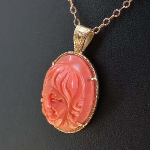 308 - 18 Carat Yellow Gold Mounted Pendant Red Coral Carved Classical Profile 3cm High Further Set on 9 Ca... 