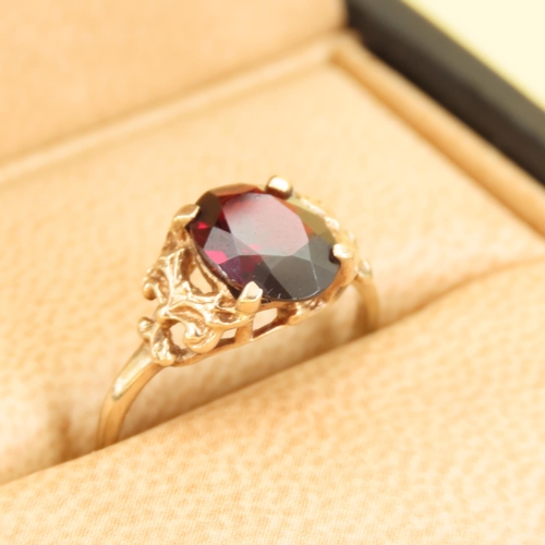 309 - Red Garnet Centerstone Ring Four Claw Set Mounted on 9 Carat Yellow Gold Band Size L