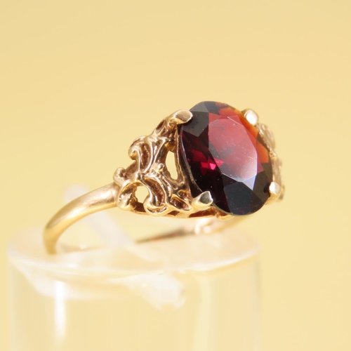 309 - Red Garnet Centerstone Ring Four Claw Set Mounted on 9 Carat Yellow Gold Band Size L