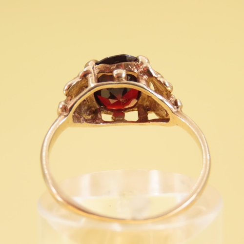 309 - Red Garnet Centerstone Ring Four Claw Set Mounted on 9 Carat Yellow Gold Band Size L