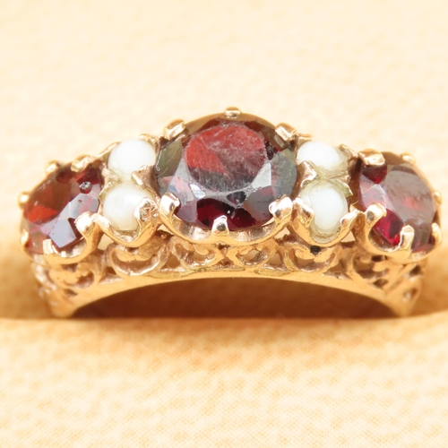 31 - Red Garnet and Seed Pearl Ring Mounted on 9 Carat Yellow Gold Band Size K