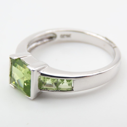 329 - Princess Cut Peridot Center Stone Ring with Further Peridot set to Shoulders Mounted on 9 Carat Whit... 