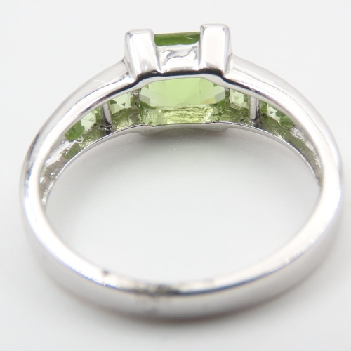 329 - Princess Cut Peridot Center Stone Ring with Further Peridot set to Shoulders Mounted on 9 Carat Whit... 