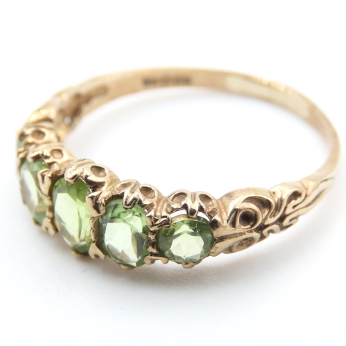 336 - Five Stone Peridot Ladies Ring Mounted on 9 Carat Yellow Gold Band Ring Size T