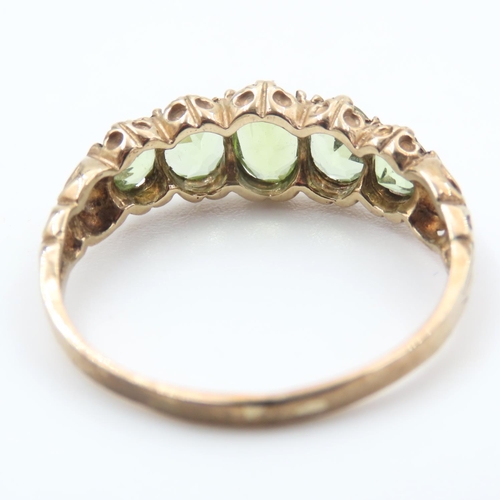 336 - Five Stone Peridot Ladies Ring Mounted on 9 Carat Yellow Gold Band Ring Size T