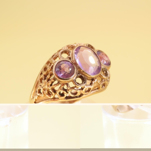 346 - Three Stone Amethyst Ladies Ring Mounted on 9 Carat Yellow Gold Openwork Scroll Setting Ring Size O