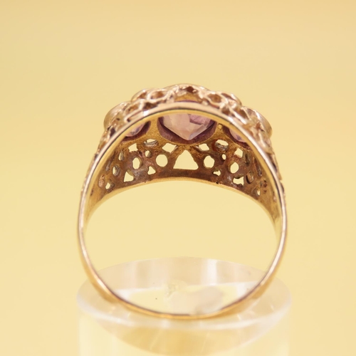 346 - Three Stone Amethyst Ladies Ring Mounted on 9 Carat Yellow Gold Openwork Scroll Setting Ring Size O