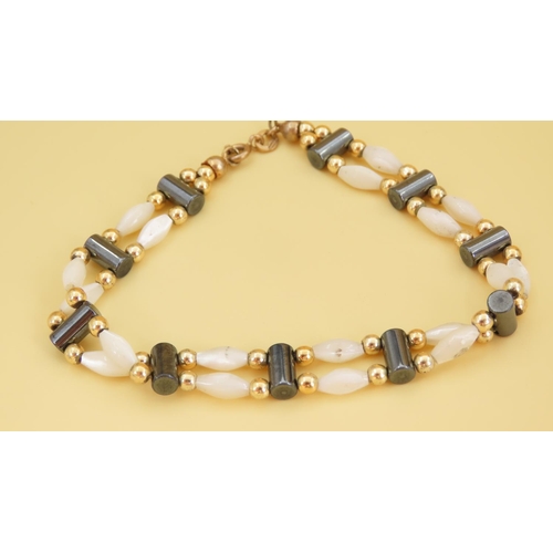 351 - Mother of Pearl Twin Row 9 Carat Yellow Gold Mounted Ladies Bracelet of Articulated Form 17.5cm Long