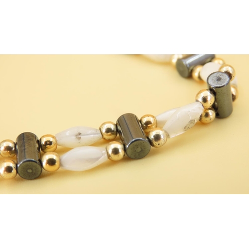 351 - Mother of Pearl Twin Row 9 Carat Yellow Gold Mounted Ladies Bracelet of Articulated Form 17.5cm Long