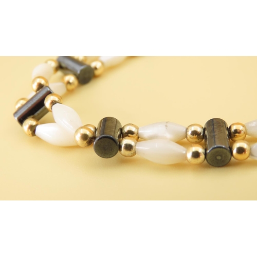 351 - Mother of Pearl Twin Row 9 Carat Yellow Gold Mounted Ladies Bracelet of Articulated Form 17.5cm Long