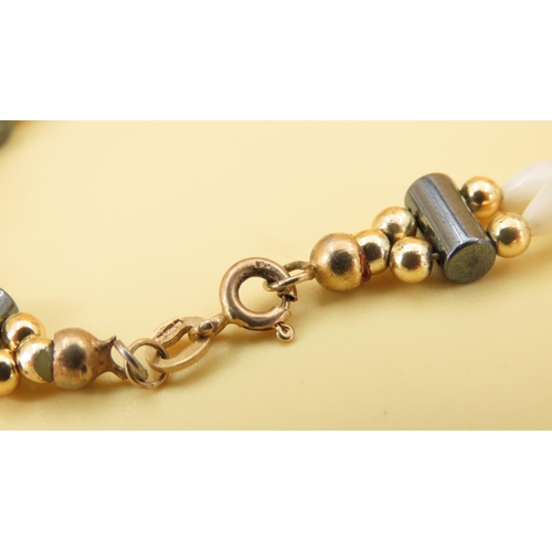 351 - Mother of Pearl Twin Row 9 Carat Yellow Gold Mounted Ladies Bracelet of Articulated Form 17.5cm Long