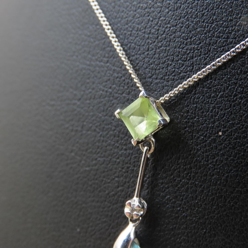 384 - Blue Topaz Peridot and Diamond Set Pendant 9 Carat Yellow Gold Pendant 3cm High Mounted on 9 Carat W... 