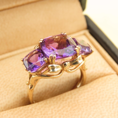 414 - Amethyst Three Stone Ring of Fine Hue Mounted on 9 Carat Yellow Gold Band Size P