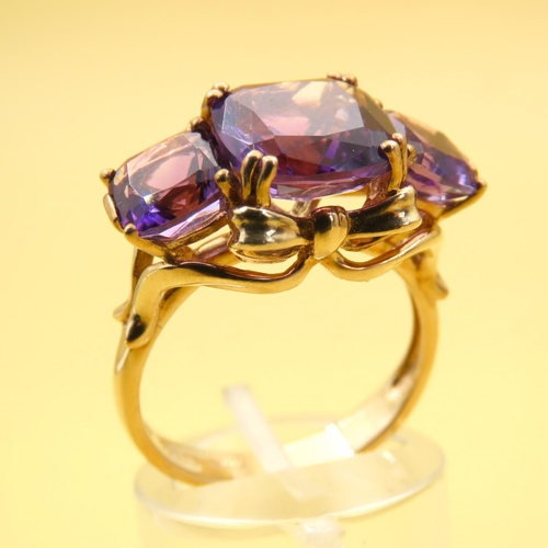 414 - Amethyst Three Stone Ring of Fine Hue Mounted on 9 Carat Yellow Gold Band Size P