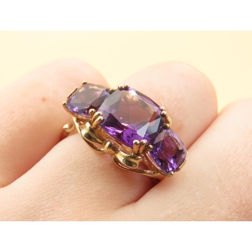 414 - Amethyst Three Stone Ring of Fine Hue Mounted on 9 Carat Yellow Gold Band Size P