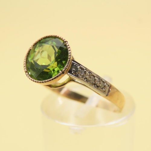 416 - Peridot and Diamond Set Ladies Ring Mounted on 9 Carat Yellow Gold Band Attractively Detailed Ring S... 