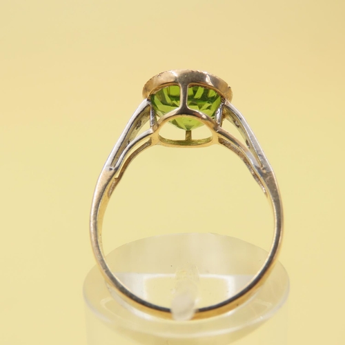 416 - Peridot and Diamond Set Ladies Ring Mounted on 9 Carat Yellow Gold Band Attractively Detailed Ring S... 