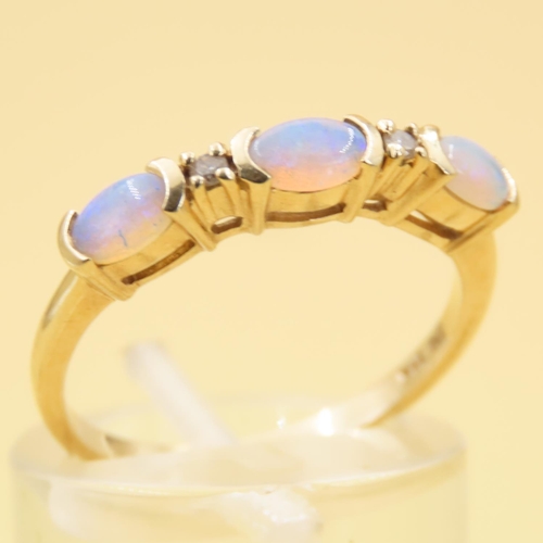 42 - Three Stone Opal and Diamond Ring Mounted on 14 Carat Yellow Gold Band Size N and a Half
