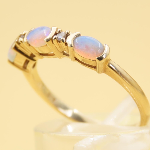 42 - Three Stone Opal and Diamond Ring Mounted on 14 Carat Yellow Gold Band Size N and a Half