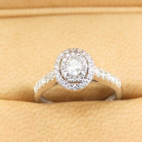 438 - 18 Carat White Gold Diamond Solitaire Ring Halo Set with Further Diamond Decorated Shoulders Attract... 