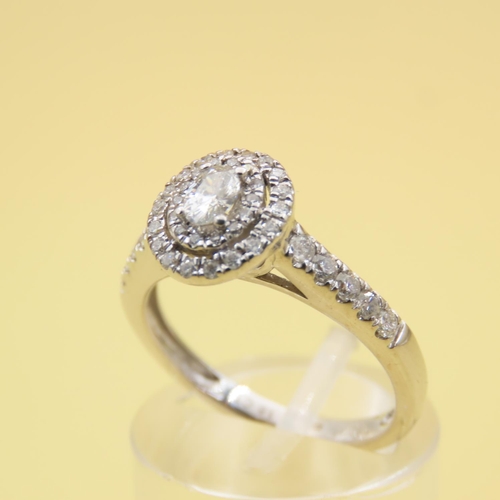 438 - 18 Carat White Gold Diamond Solitaire Ring Halo Set with Further Diamond Decorated Shoulders Attract... 