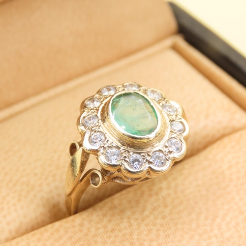 440 - Emerald and Twelve Diamond Set Cluster Ring Mounted on 9 Carat Yellow Gold Band Size M