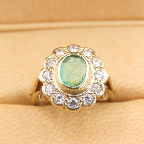 440 - Emerald and Twelve Diamond Set Cluster Ring Mounted on 9 Carat Yellow Gold Band Size M