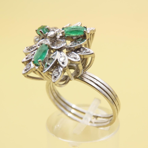 478 - Emerald and Diamond Floral Design Cluster Ring Mounted on 18 Carat White Gold Attractively Detailed ... 