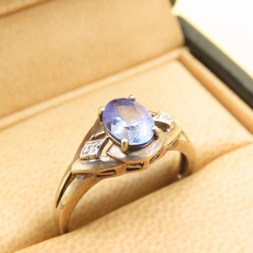 483 - Tanzanite and Diamond Ring Mounted on 9 Carat Yellow Gold Band Size Q