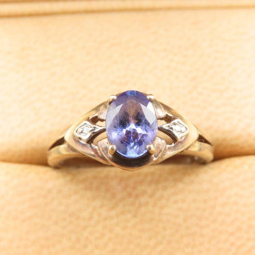 483 - Tanzanite and Diamond Ring Mounted on 9 Carat Yellow Gold Band Size Q