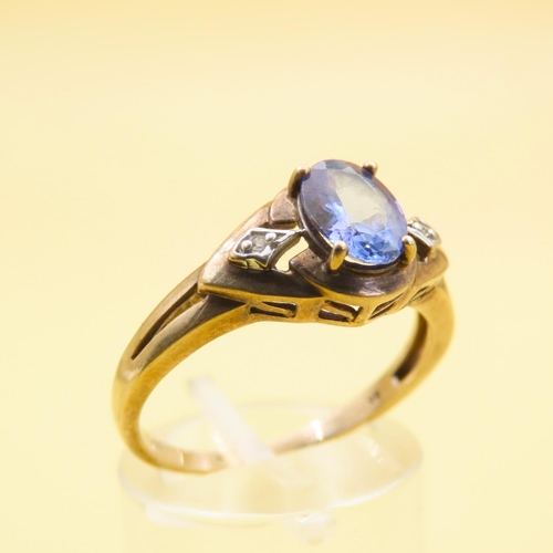 483 - Tanzanite and Diamond Ring Mounted on 9 Carat Yellow Gold Band Size Q