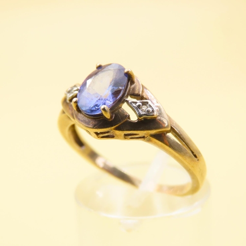 483 - Tanzanite and Diamond Ring Mounted on 9 Carat Yellow Gold Band Size Q