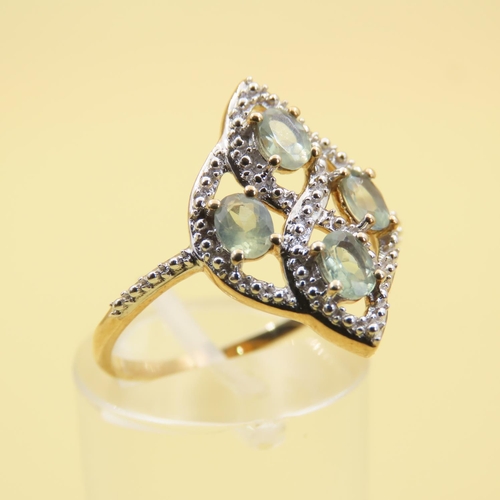 489 - Aquamarine and Diamond Ring Mounted on 10 Carat Yellow Gold Attractively Detailed Band Size Q