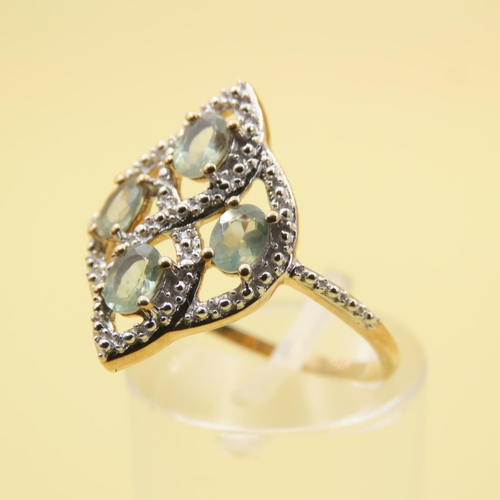 489 - Aquamarine and Diamond Ring Mounted on 10 Carat Yellow Gold Attractively Detailed Band Size Q