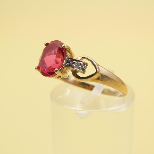 495 - Red Spinel and Diamond Set Ring Mounted on 9 Carat Yellow Gold Band Size P