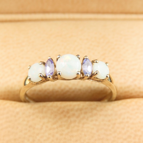 546 - Opal and Amethyst Set Ladies Ring Mounted on 9 Carat Yellow Gold Band Size T