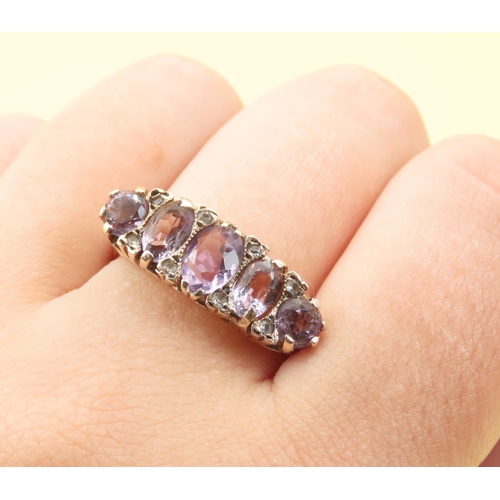 547 - Five Stone Amethyst and Diamond Ring Mounted on 9 Carat Yellow Gold Attractively Detailed Band Size ... 