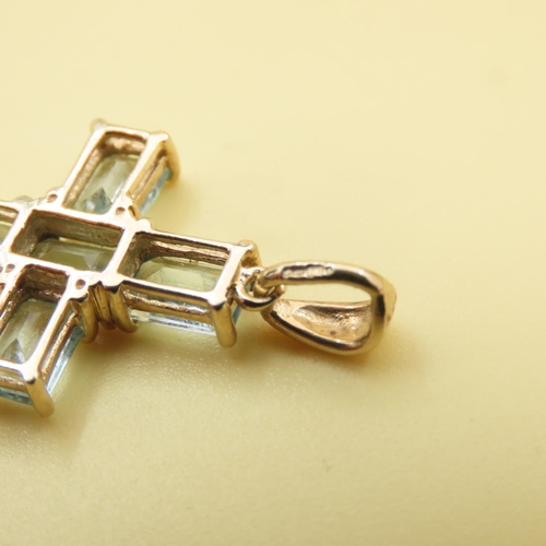 553 - Six Stone Aquamarine Cross Pendant Set in 9 Carat Yellow Gold 3cm Drop