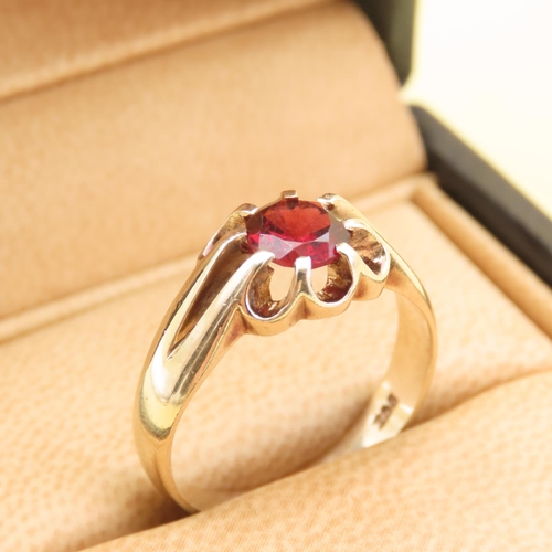 558 - Red Garnet Center Stone Ring Mounted on 9 Carat Yellow Gold Band Size T