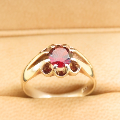 558 - Red Garnet Center Stone Ring Mounted on 9 Carat Yellow Gold Band Size T