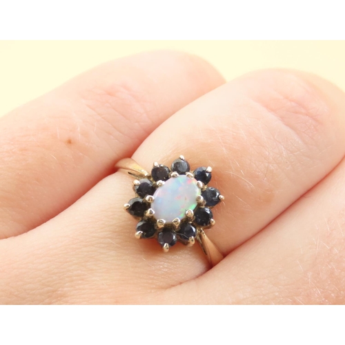 561 - Opal and Sapphire Ladies Cluster Ring Mounted on 9 Carat Yellow Gold Band Size N and a Half