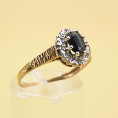 566 - Sapphire and Diamond Cluster Ring Mounted on 9 Carat Yellow Gold Band Size R and a Half