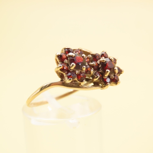 574 - Red Garnet Flower Motif Cluster Ring Mounted on 9 Carat Yellow Gold Band Size R and a Half