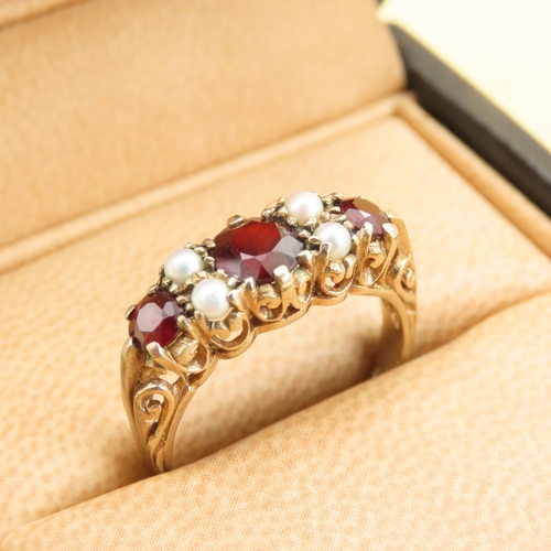 575 - Three Stone Red Garnet and Seed Pearl Ring Mounted on 9 Carat Yellow Gold Band Size P