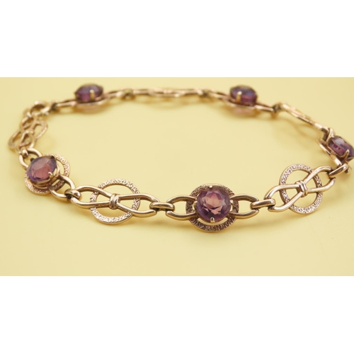 579 - Fancy Link Amethyst Set Bracelet Mounted in 9 Carat Yellow Gold at 19cm Long